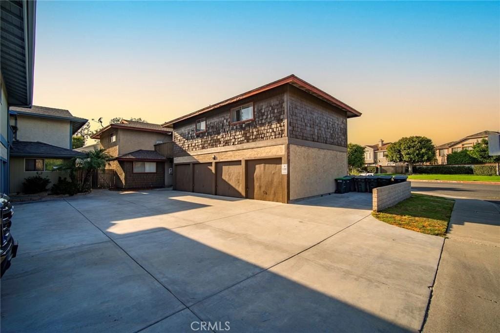 property exterior at dusk with a garage