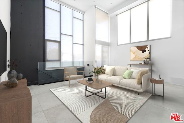 living room with a towering ceiling and a wealth of natural light