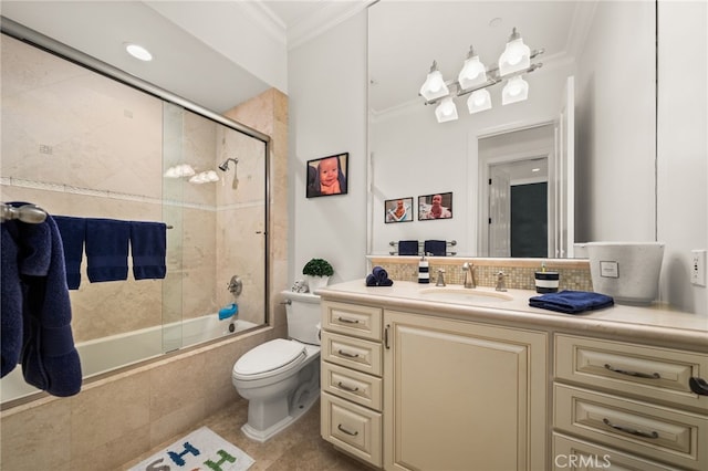 full bathroom with tile patterned floors, toilet, ornamental molding, bath / shower combo with glass door, and vanity