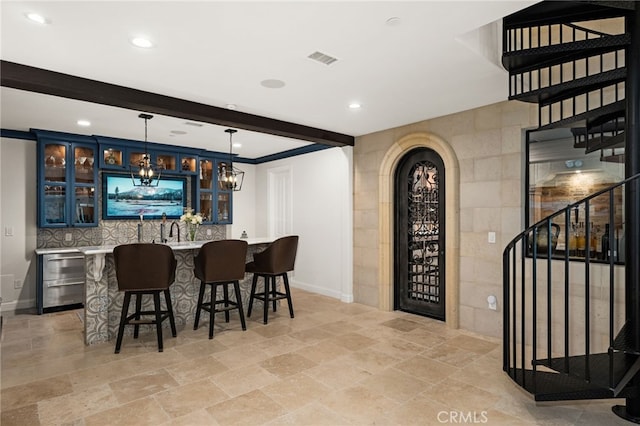 bar with wine cooler, beamed ceiling, decorative light fixtures, and tile walls