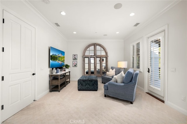 living room with crown molding and light colored carpet