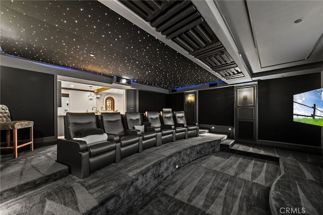 cinema room featuring dark carpet