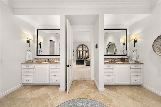 bathroom featuring vanity and ornamental molding