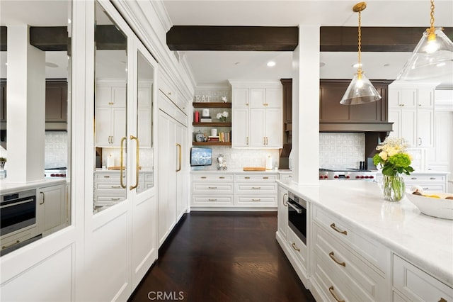 kitchen featuring white cabinets, tasteful backsplash, hanging light fixtures, dark hardwood / wood-style flooring, and stainless steel appliances