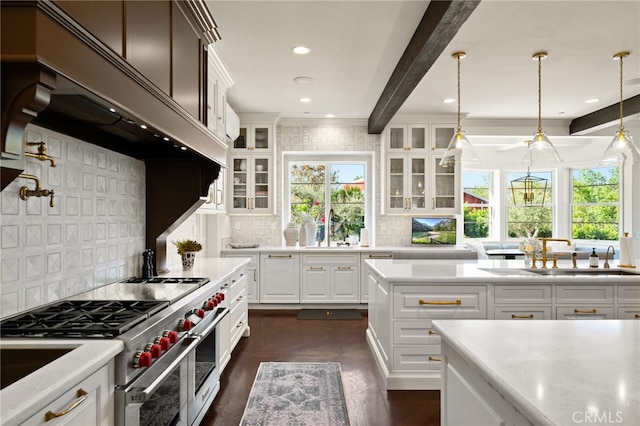 kitchen with custom exhaust hood, white cabinets, beam ceiling, luxury stove, and tasteful backsplash