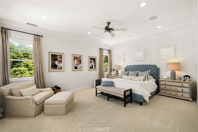 carpeted bedroom featuring crown molding and ceiling fan