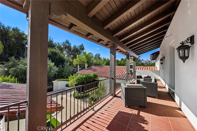 view of patio featuring a balcony