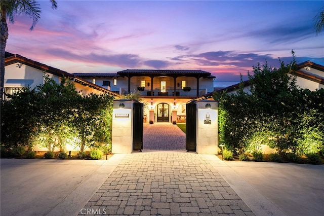 mediterranean / spanish home with a balcony