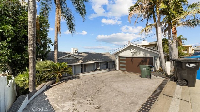 view of front of property featuring an outbuilding and a garage