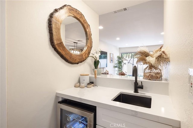 bathroom featuring vanity and wine cooler