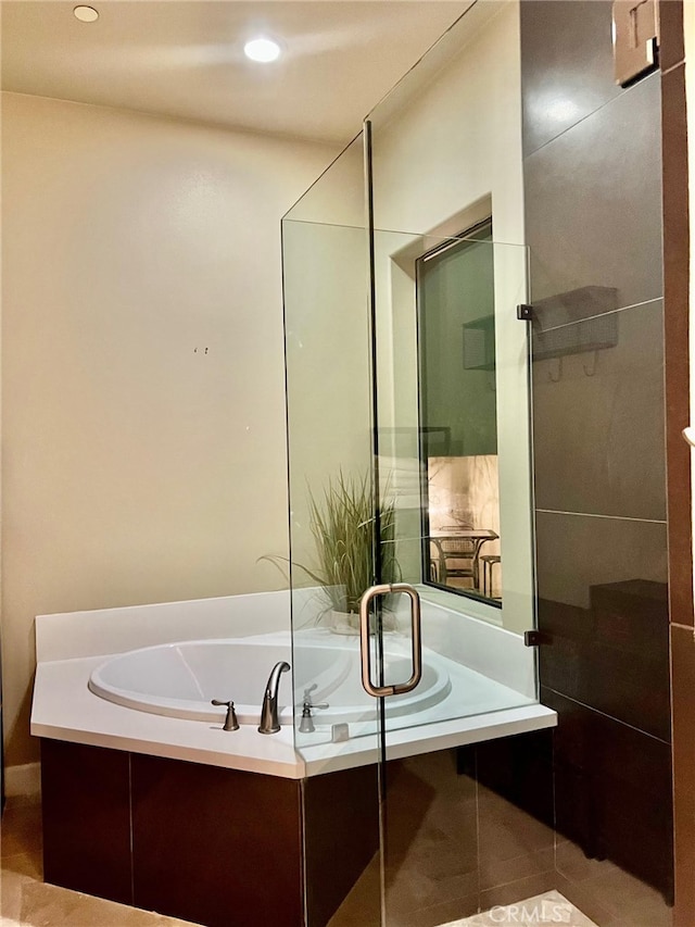 bathroom featuring shower with separate bathtub and tile patterned flooring