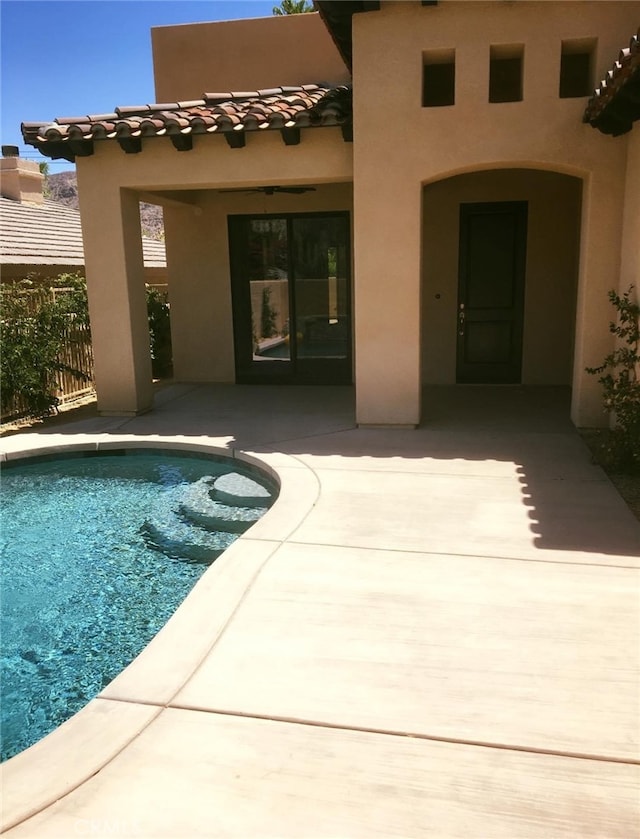 view of swimming pool featuring a patio area