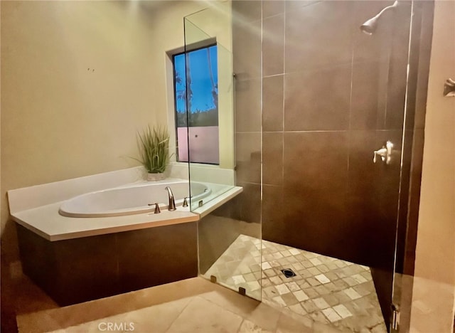 bathroom featuring separate shower and tub and tile patterned floors