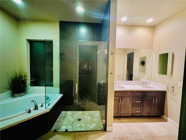 bathroom with tile patterned flooring, vanity, and plus walk in shower