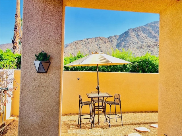 view of patio / terrace with a mountain view