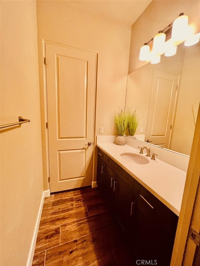 bathroom featuring vanity and hardwood / wood-style flooring