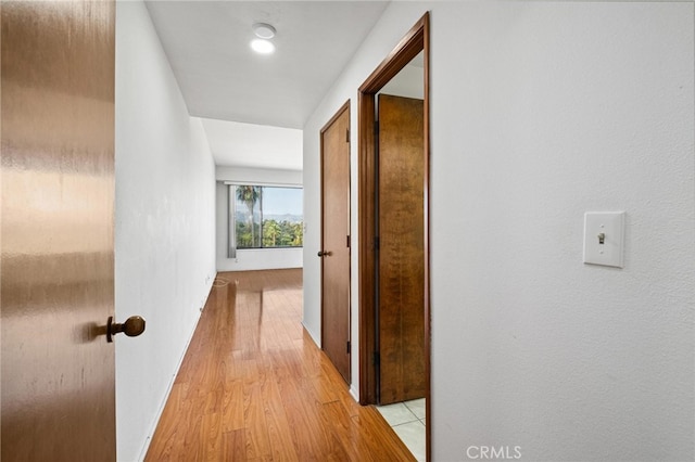 hallway with light wood-type flooring