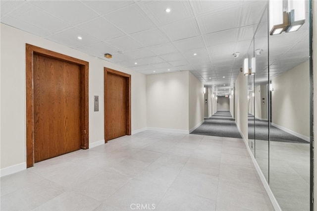 unfurnished room with a paneled ceiling