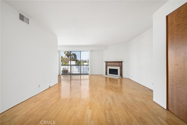 unfurnished living room featuring light wood-type flooring