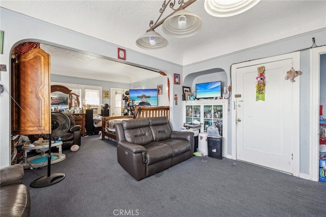 carpeted living room featuring a textured ceiling