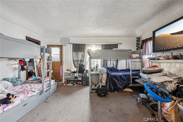 carpeted bedroom with a textured ceiling