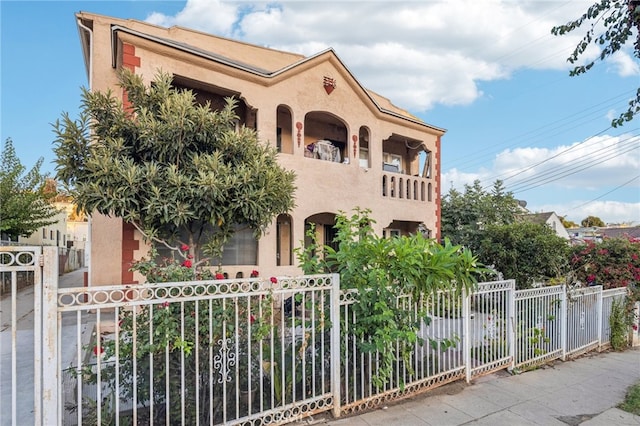 mediterranean / spanish home featuring a balcony