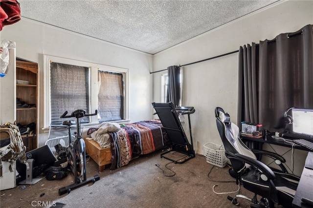 bedroom featuring a textured ceiling and carpet flooring