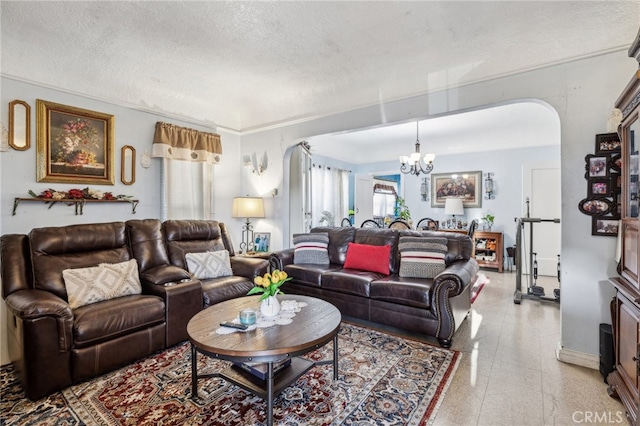 living room with a textured ceiling and a chandelier