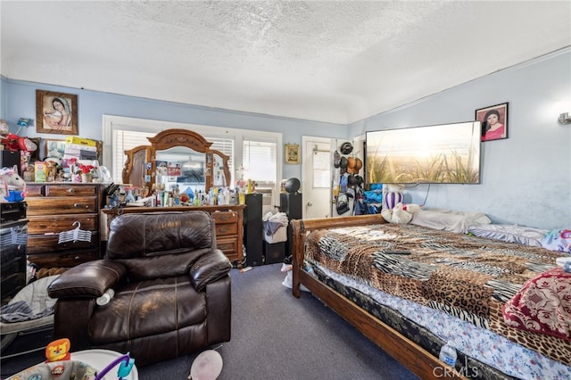 carpeted bedroom with a textured ceiling and lofted ceiling