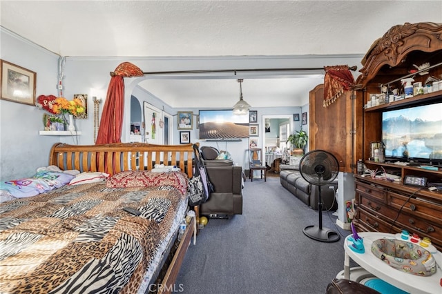 carpeted bedroom with a textured ceiling