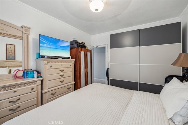 bedroom featuring ornamental molding and ceiling fan