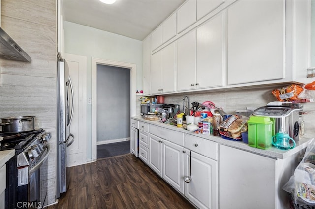 kitchen featuring stainless steel appliances, white cabinets, ventilation hood, and dark hardwood / wood-style flooring