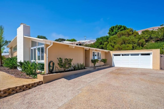 single story home with a garage