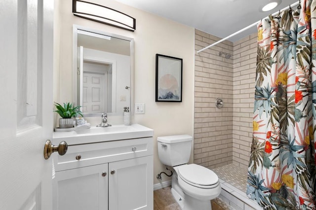 bathroom featuring vanity, toilet, and a shower with shower curtain