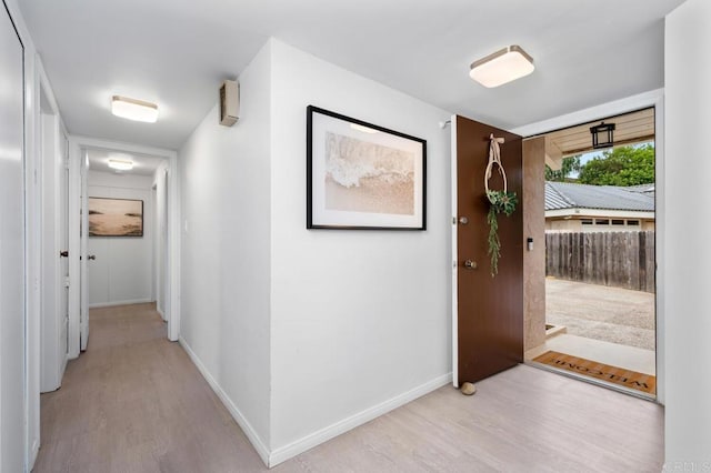 foyer entrance with light hardwood / wood-style floors