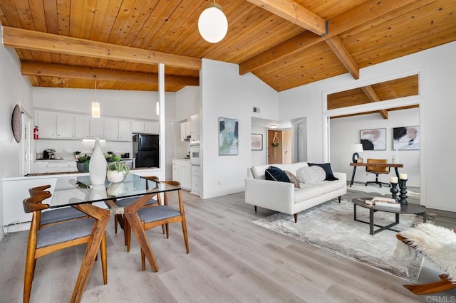 dining area with wood ceiling, beam ceiling, high vaulted ceiling, and light hardwood / wood-style flooring