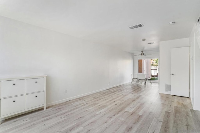 unfurnished living room featuring ceiling fan and light hardwood / wood-style floors