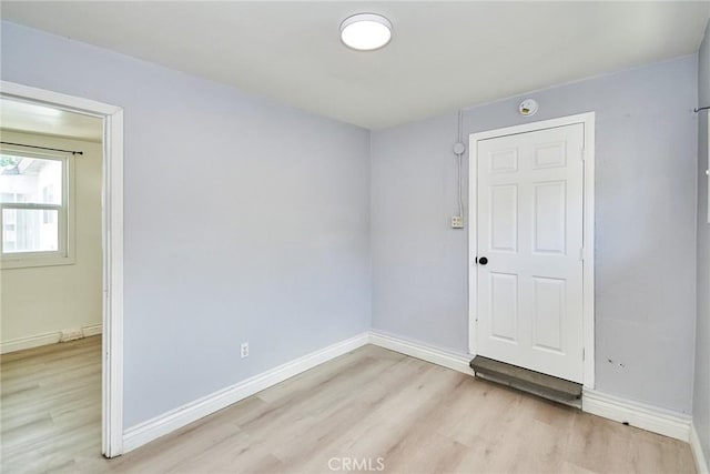 unfurnished room featuring light wood-type flooring