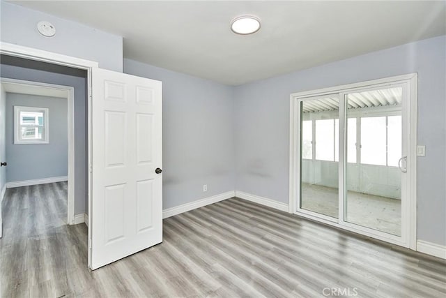 empty room with light hardwood / wood-style floors