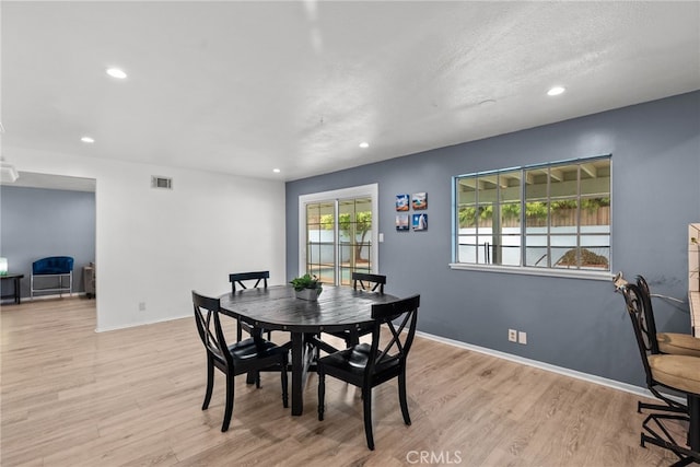 dining space featuring light hardwood / wood-style floors