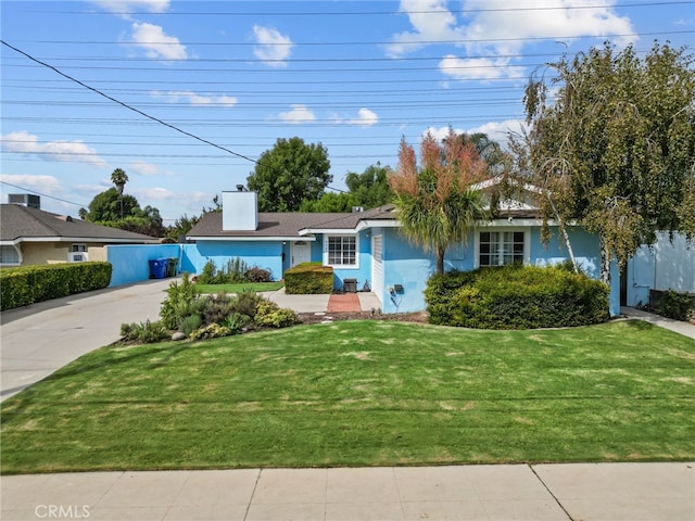 ranch-style home with a front yard