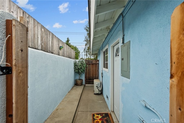 view of side of home featuring ac unit