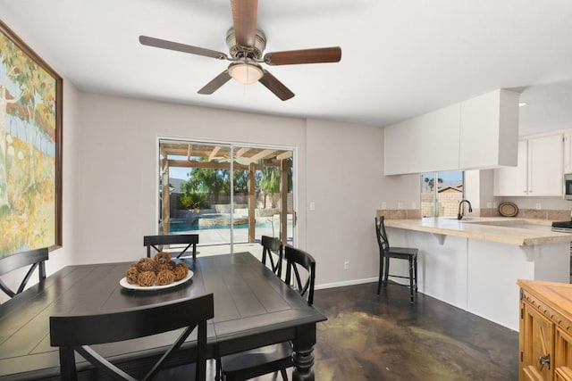 dining space with ceiling fan