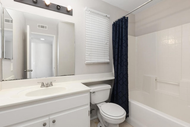 full bathroom with vanity, shower / bath combo with shower curtain, and toilet