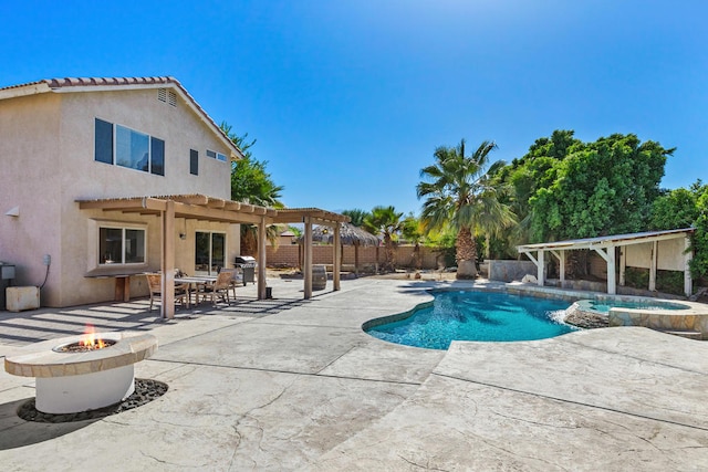 view of swimming pool featuring a grill, a pergola, a patio area, and an outdoor fire pit