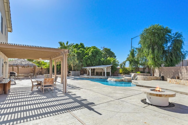 view of pool featuring a pergola, a patio, and an outdoor fire pit