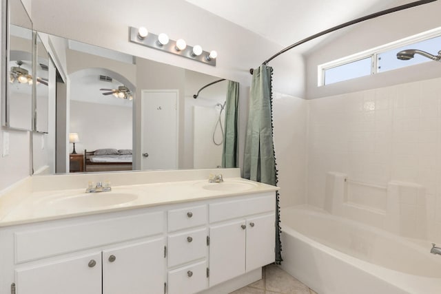 bathroom featuring ceiling fan, vanity, shower / tub combo, and tile patterned flooring