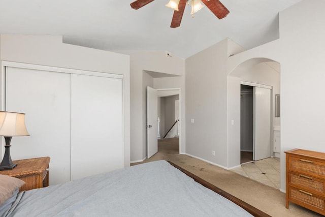 carpeted bedroom with lofted ceiling and ceiling fan