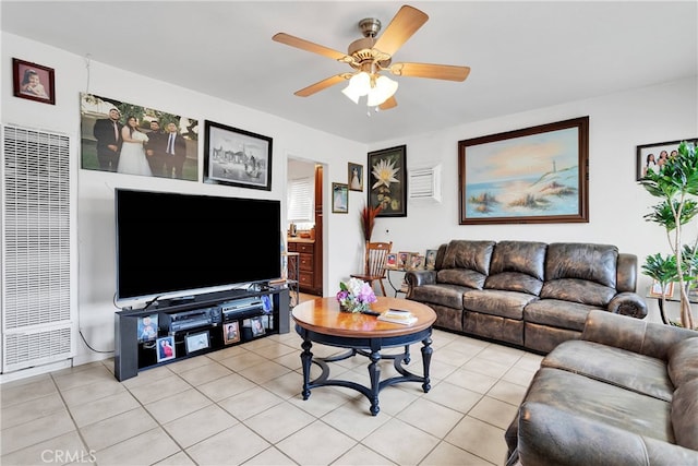 living room featuring ceiling fan and light tile patterned flooring