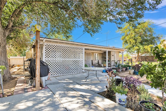 back of property with a patio area